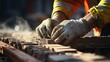 © maria_lh - Close-up of the hands of an industrial bricklayer installing bricks on a construction site