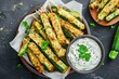 Crispy Baked Zucchini Fries with Garlic Yogurt Sauce - Top View of Crunchy Courgette Sticks Perfect for Brunch or Cooking