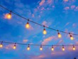 Light bulb decor on the blue sky in the outdoor party.