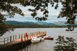 Several boats moored on the boardwalk, lake Windermere in England