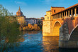 Panorama of Ponte Coperto (covered bridge) and Duomo di Pavia (Pavia Cathedral) in Pavia at sunny day, Lombardy, italy.