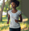 A fit American African Woman in sport attire jogging in outdoor