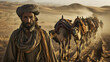Berber man leading camel caravan. Morroco.