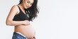 Pregnant woman in black top and jeans