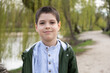 © Zarina Lukash - Portrait of 6 year old boy in spring park.