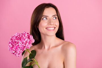 Wall Mural - Photo of attractive lady hold flowers phloxes look empty space advertise organic pampering procedure isolated over pastel color background