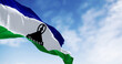 National flag of Lesotho waving in the wind on a clear day