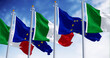 Italy and European Union flags waving on a clear day