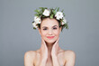 © artmim - Good-looking model woman with natural make-up, healthy skin and white flower. Female beauty, cosmetology and skincare concept