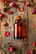 rose essential oil in a bottle. selective focus.