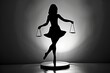black silhouette of a woman balancing on scales