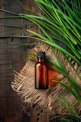 Wall Mural - vetiver essential oil in a bottle. selective focus.