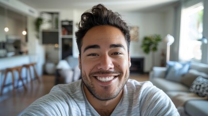 Wall Mural - Smiling man with curly hair in a modern living room.