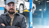 Fototapeta Panele - Professional Car Mechanic Portrait