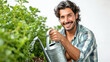 A smiling American man holding a watering can while watering,