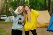 © makedonski2015 - Two friends during a hike in the forest. Summer camping. The women saw a wild animal