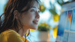 © visoot - Japanese beautiful woman looking at a computer screen displaying, joyfully. Generative AI.