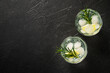 Gin tonic, traditional cocktail on black background. Top view with space for design.