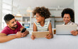 © NDABCREATIVITY - Obsessed to tech devices happy african american family using digital tablet, computer, smartphones