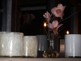 Canvas Print - vases filled with flowers sit in front of candles on a counter