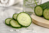 Fototapeta  - The magical effects of a cucumber-infused skin care product,