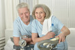 Portrait of happy sporty senior couple exercising