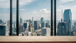 frontal view on empty clean wooden desk workplace; minimalist office background with panoramic view on big city skyline; digital home office concept