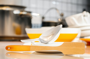 Canvas Print - One wooden spatula on the background of the kitchen, macro.