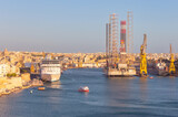 Fototapeta Boho - A large white tourist boat near the Valletta pier on a sunny morning.