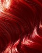 Close-up of vibrant red hair with glossy texture and subtle shimmer, highlighting individual strands and their vivid color