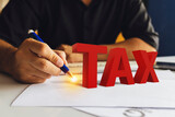 Fototapeta  - Business TAX plan development. calculation tax return concept.