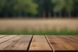 Wooden board empty table in front of blurred natural.