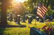 Graves with monuments in the cemetery and the flag of America, military memorial day