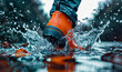 close up on orange rubber boot splashing in flooded water seen from below wallpaper