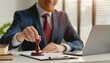 © Marko - Man hand stamping with approved stamp on document at desk, notary or business people