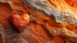 love concept: red heart on a natural and colorful sandstone background - wallpaper, postcards, cards. 