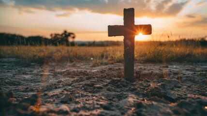 Sticker - Majestic Cross Silhouetted Against Stunning Sunset Sky in Peaceful Rural Landscape