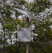 Mast with power source, tracking and transmitting devices in protected natural areas.