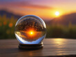 Glass transparent ball for predictions against a background of sunset and mountains, air bubbles, reflection