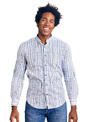 Wall Mural - Handsome african american man with afro hair wearing casual clothes looking positive and happy standing and smiling with a confident smile showing teeth