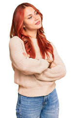 Canvas Print - Young redhead woman wearing casual winter sweater looking to the side with arms crossed convinced and confident