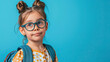 Funny child school girl on pastel blue background