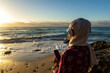 © ADDICTIVE STOCK - Peaceful Muslim woman enjoying sunset at the beach