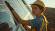Beautiful young engineer near solar panels 