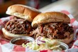 two pulled pork sandwiches with cole slaw
