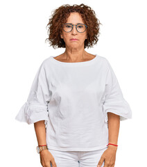 Poster - Beautiful middle age mature woman wearing casual clothes and glasses depressed and worry for distress, crying angry and afraid. sad expression.