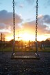 Swing hanging from chain in a park, suitable for outdoor recreation concept