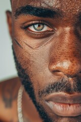 Canvas Print - Close-up of a man's face with a chain necklace, suitable for various concepts and designs