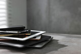 Fototapeta Koty - Many different modern gadgets on grey table indoors. Space for text
