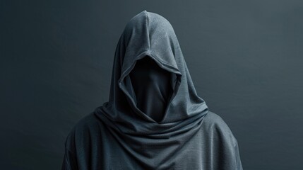 Wall Mural - A person in a hoodie standing in front of a dark background. Suitable for mystery or urban themes